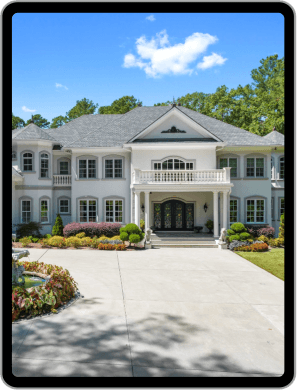 Tablet screen showing driveway leading to large house